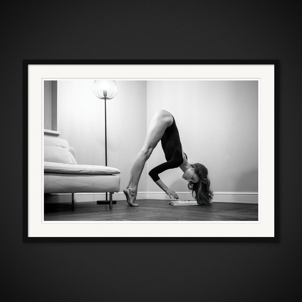 Dialectic Balance — An inverted pose interrupts the order of an armchair and a lamp. Framed edition by Albert Pocej.