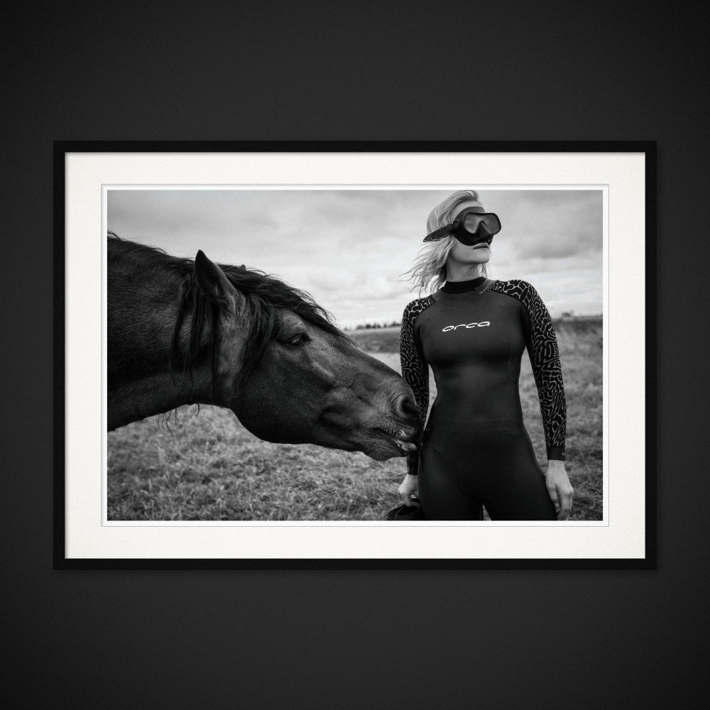 Seahorse Illusion — A horse meets a woman wearing a wetsuit and diving mask. Framed edition by Albert Pocej.